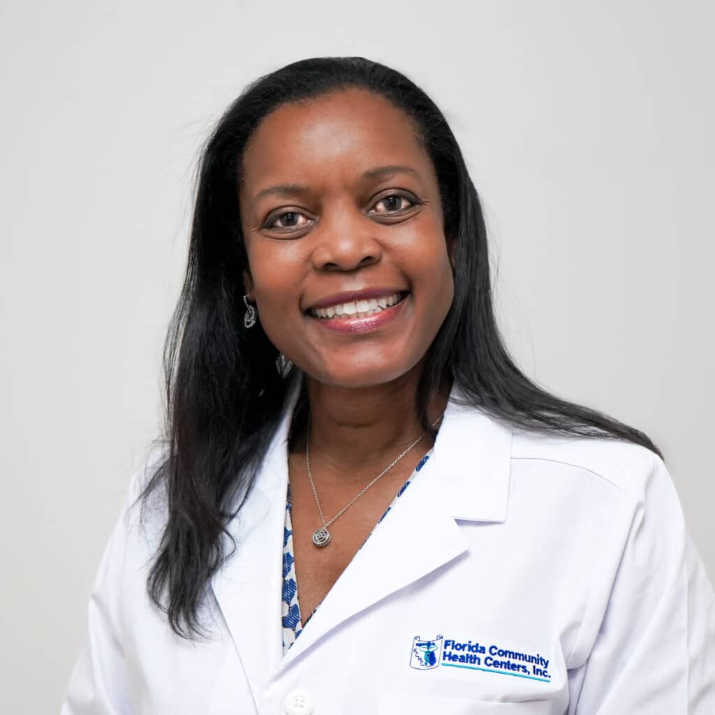 Headshot of Aryanna F. Lee, M.D., FAAP smiling in a white FCHC lab coat.