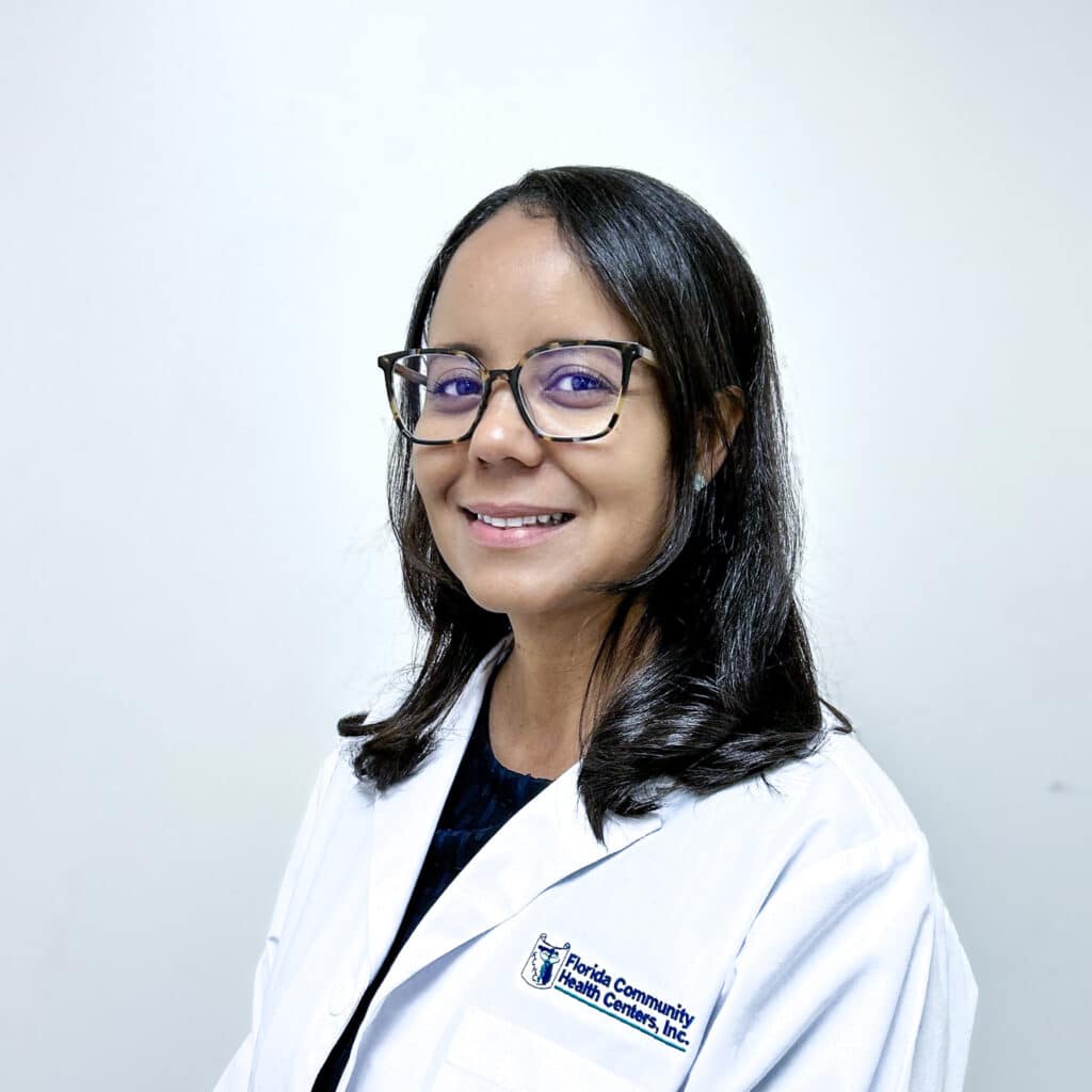 Headshot of Anelkis Vieira, APRN, smiling in a white FCHC lab coat.
