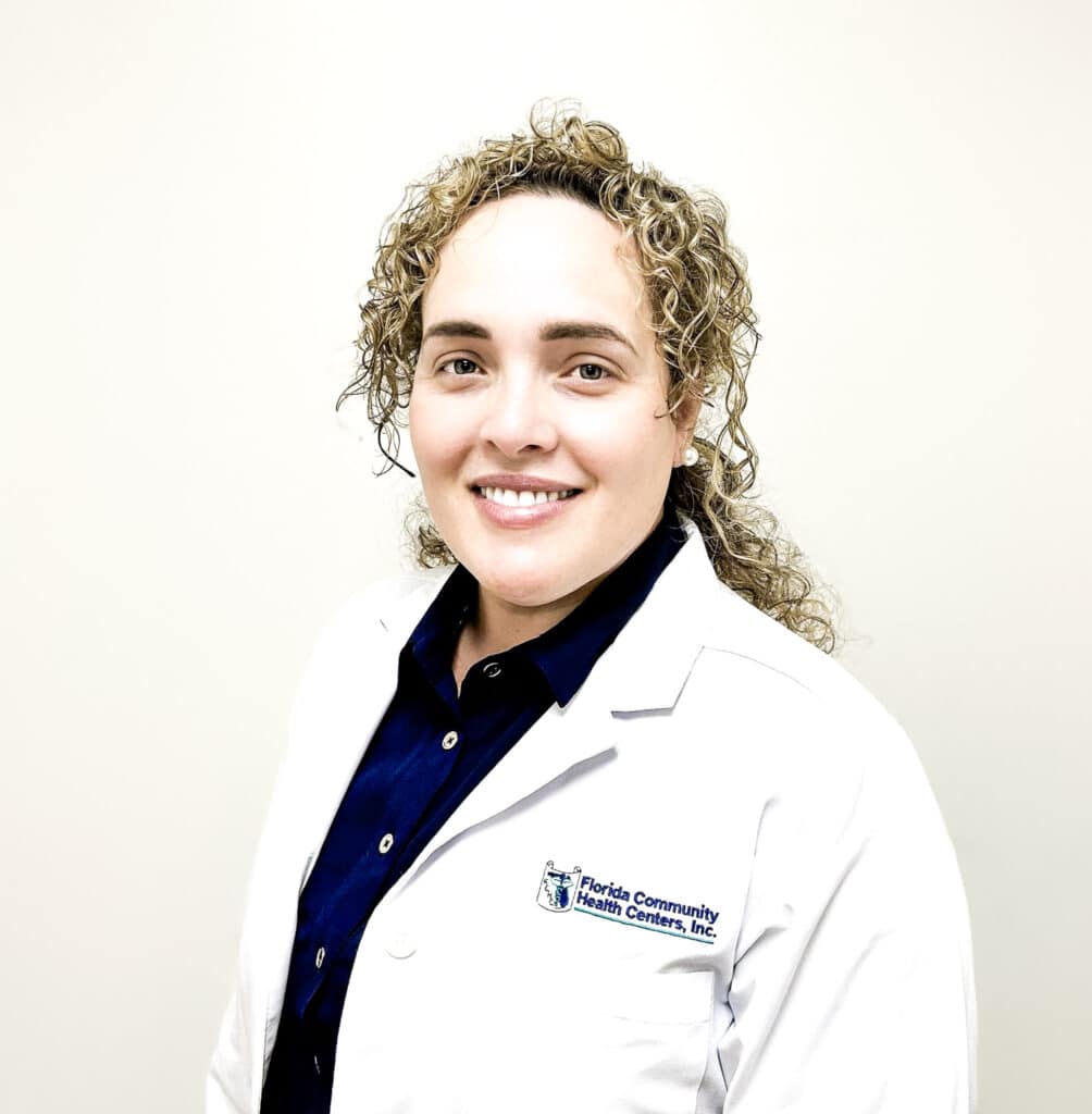Liamny Diaz Vazquez, APRN, smiling in a white FCHC lab coat.