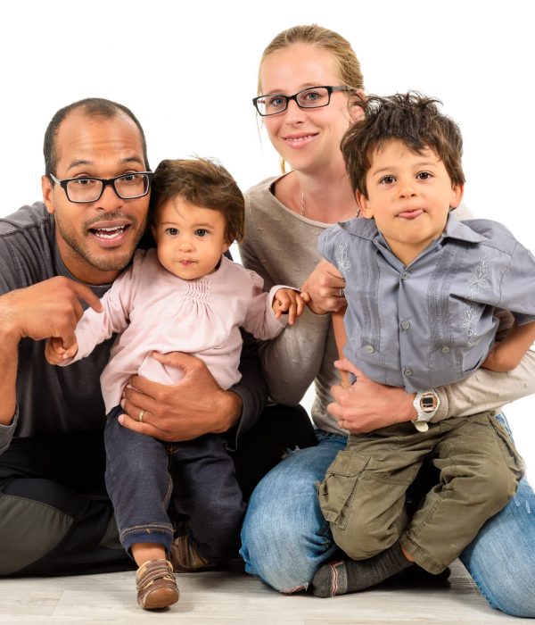 Happy interracial family isolated on white