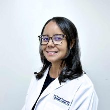 Headshot of Anelkis Vieira, APRN, smiling in a white FCHC lab coat.