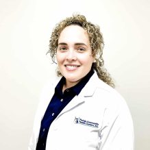 Liamny Diaz Vazquez, APRN, smiling in a white FCHC lab coat.